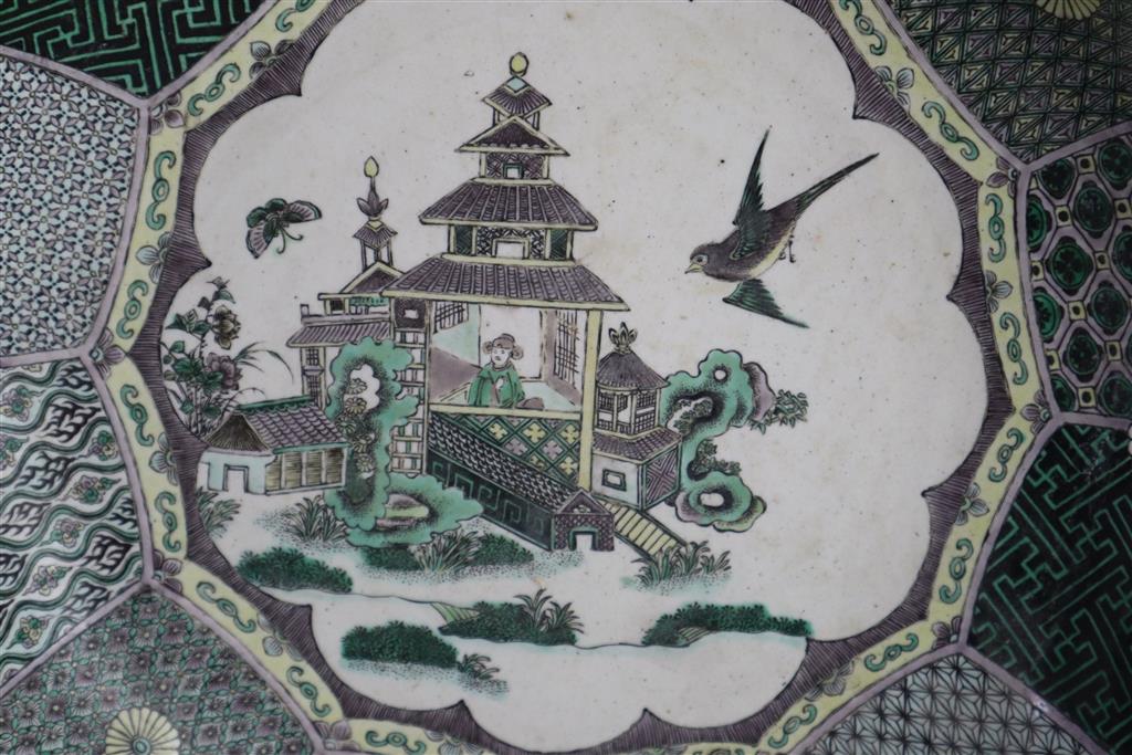 An unusual Chinese famille verte decorated biscuit porcelain twelve sided dish, 19th century in Kangxi style, 26cm wide